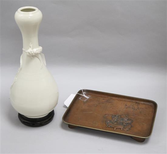 A Chinese Song-style blanc-de-chine dragon vase and a Japanese copper tray, H 30cm approx